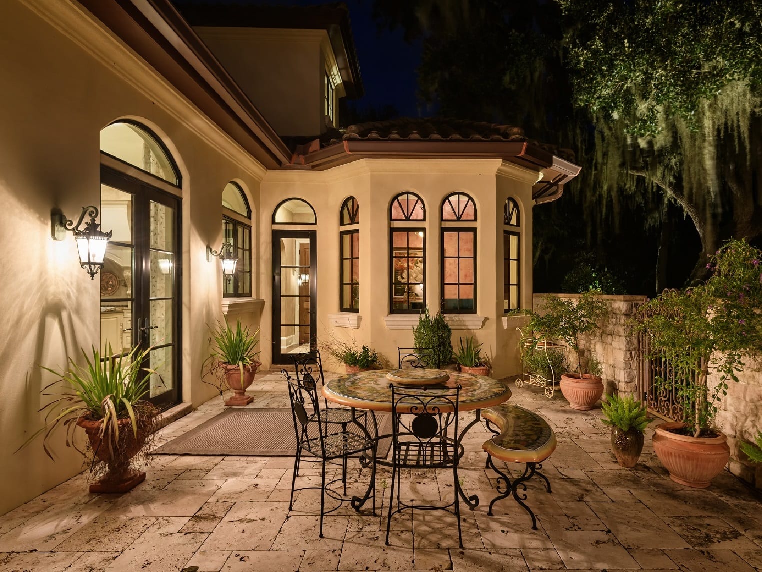 Patio area with a tablet, chairs, and plants