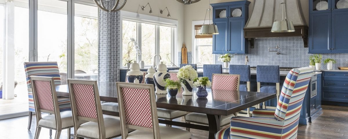 Dining area near a blue kitchen