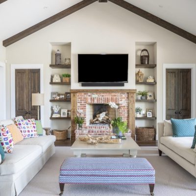 Living room area with a television and a fireplace