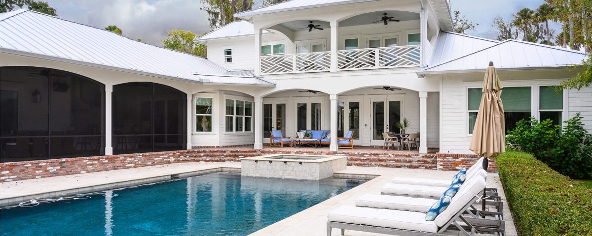 Swimming pool and poolside lounge areas of a large property