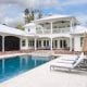 Swimming pool and poolside lounge areas of a large property