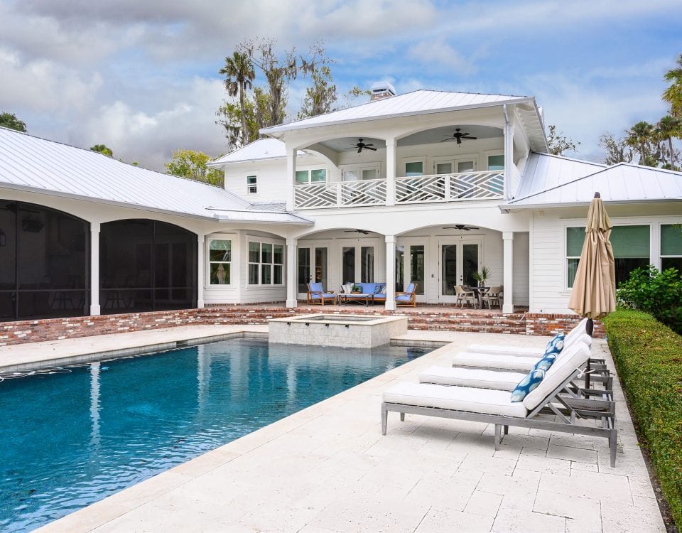 Swimming pool and poolside lounge areas of a large property