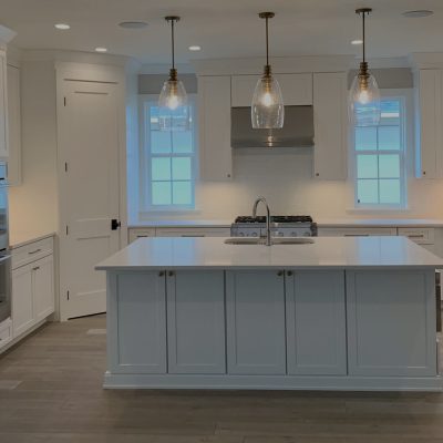 White kitchen with complete appliances and furnishings