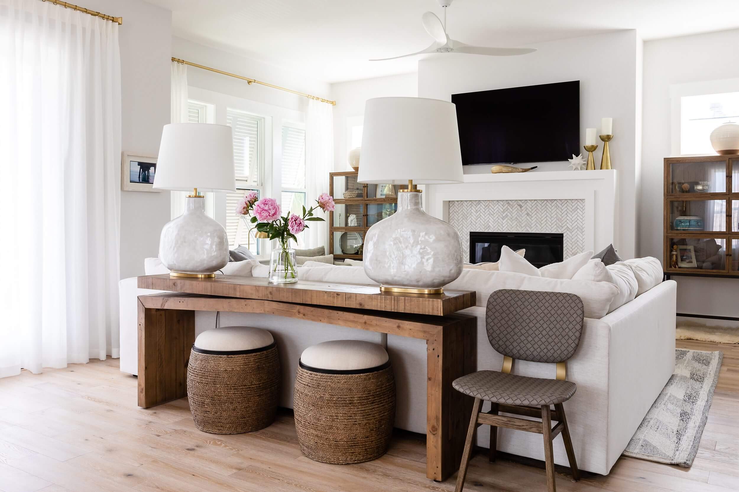 Cozy living room with wooden furniture and soft lighting.